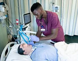 Female nursing student at mannequin